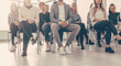 © yurolaitsalbert - background image of a group of employees sitting in a conference room