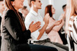 © yurolaitsalbert - close up. a group of young people applauding in the conference r