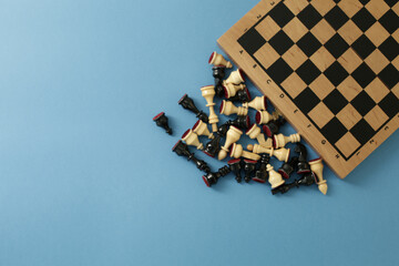 Chess pieces and board on a blue background