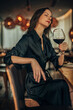 © eastwest photo - woman drinking wine in the bar