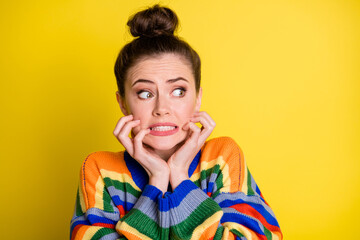 Sticker - Photo of impressed scared brunette girl look empty space wear rainbow sweater isolated on bright yellow color background