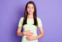Photo Portrait Of Dreamy Girl Keeping Hands On Tummy After Delicious Breakfast Smiling Isolated On Vibrant Purple Color Background