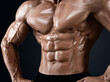 © Sergey Chips - Male abdominal muscles, Bodybuilder shows abs, Dark background