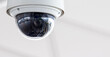 © TimmyTimTim - Closeup of white dome type cctv digital security camera installed on ceiling for observation.