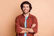 © deagreez - Photo of self-assured guy toothy smile look camera folded arms wear brown t-shirt isolated beige color background