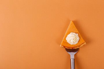 Wall Mural - Traditional thanksgiving food on wooden table. Orange delicious homemade pumpkin pie with crust and decorative items. Thanksgiving table setting concept.Top view, close up, copy space, background.