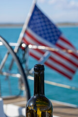 Canvas Print - a bottle of wine on the background of the American flag