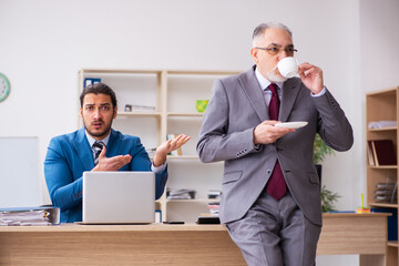 Two male colleagues working in the office