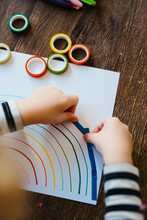 Boy Crafting A Rainbow With Colorful Washi Tape