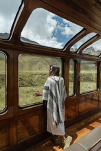 A Girl In A Poncho On A Train Ride