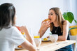 © Luis Velasco/Stocksy - Couple Of Young Girls Having Breakfast.