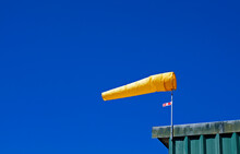 Yellow Windsock And Blue Sky 
