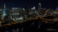 Low Fly Over Lady Bird Lake With View Of Cityscape Buildings In Downtown Austin, Texas.