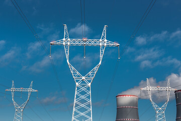 
power line wires carrying electricity from a nuclear power plant