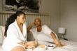 © Melissa Alexander/Creative Flame - Friends having a girls weekend relaxing at house