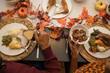 © Lynsey Weatherspoon/Creative Flame - Overhead view of black hands eating Thanksgiving holiday meal