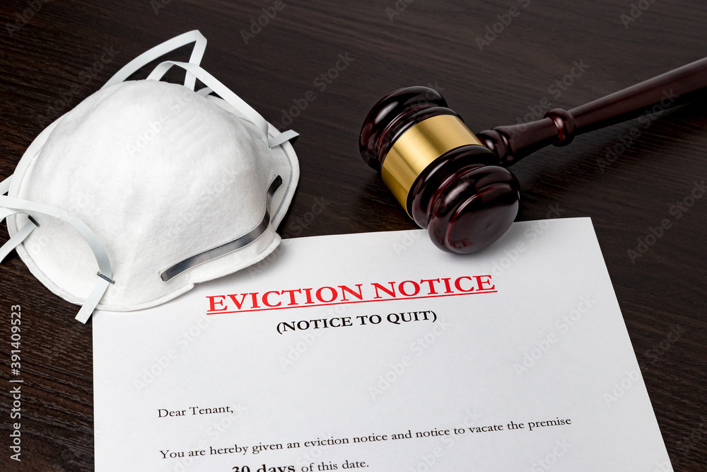 Eviction notice document with gavel and N95 face mask. Concept of financial hardship, housing crisis and mortgage payment default during Covid-19 coronavirus pandemic. - obrazy, fototapety, plakaty 