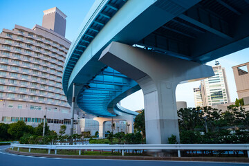 Wall Mural - Japan. Infrastructure of the Japanese city. Transport system of Japan. Two-level roads on the background of buildings. Railway bridge in a Japanese city. Travel to Japan.