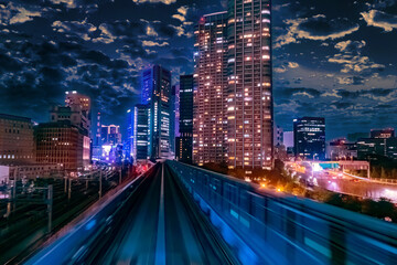 Wall Mural - Japan. Buildings and transport routes of Tokyo. Transportation of passengers by public transport. Evening in the Japanese capital. Evening city against the blue sky.