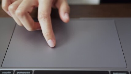 Fototapete - close-up of hands using mouse on laptop on the table.