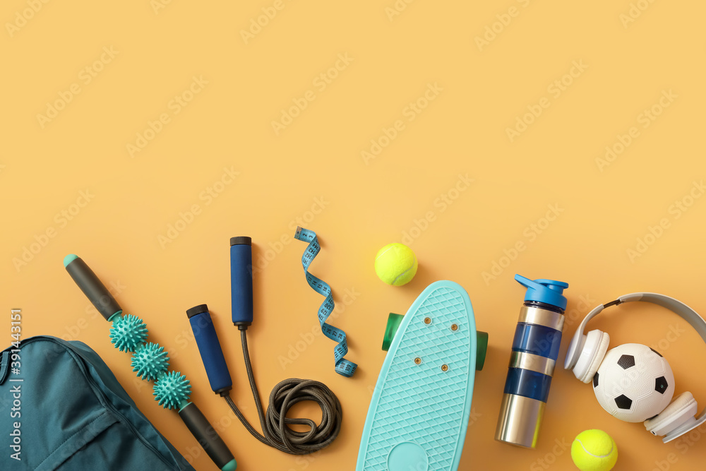 Set of sport equipment on color background