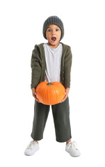 Wall Mural - Surprised African-American boy with pumpkin on white background