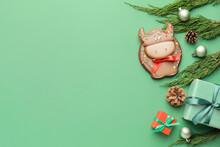 Tasty Cookie In Shape Of Bull And Christmas Decor On Color Background
