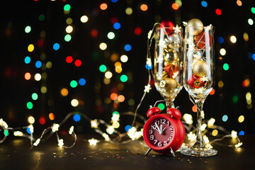 New year's holiday composition background with champagne glasses and bokeh