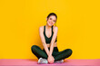 © deagreez - Portrait of attractive thin sportive cheery girl doing yoga class mat work enjoying isolated on bright yellow color background