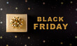 Top view of golden christmas gift boxes on black background with Black Friday text. Black Friday Sale, Banner, poster composition.