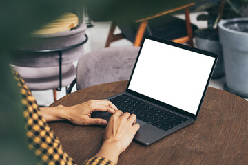 computer blank screen mockup.hand woman work using laptop with white background for advertising,contact business search information on desk at coffee shop.marketing and creative design