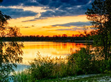 Fototapeta Krajobraz - Sunset full of colors at the Pogoria III Lake.