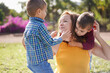© Sabrina - Mother have playful time with twin sons in nature park - Family, single mother and children love