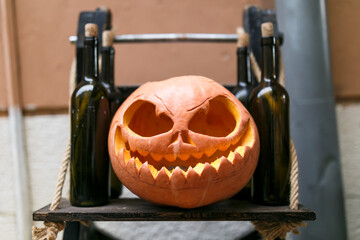 pumpkin for halloween lantern jack on the background of the house facade