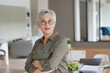 © goodluz - Portrait of a attractive mature woman with white hair and eyeglasses