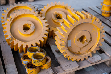 big yellow steel gears