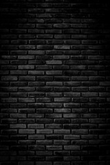 Black brick walls that are not plastered background and texture. The texture of the brick is black. Background of empty brick basement wall.