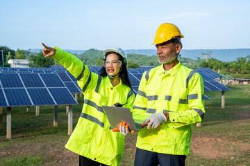 Poster - Engineer and Technician checking equipment in solar panels for great efficiency.