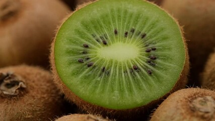 Wall Mural - kiwi fruit. heap sliced and whole kiwi fruit close up