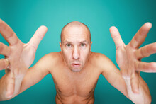Portrait Of Funny Naked Bald Man Isolated On Green Background 