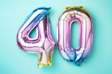 Rainbow Foil Balloon Number, Digit Forty. Birthday Greeting Card With Inscription 40. Anniversary Concept. Top View. Colored Numeral On Blue Background. Numerical Digit, Celebration Event, Template