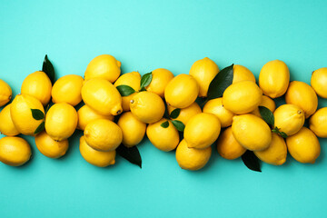 Wall Mural - Immune system booster. Fresh lemons pattern on blue background. Copy space. Top view. Flat lay. Citrus fruits. Vitamins for health. Liposomal vitamin C. Lemon for vegan, vegetarian alkaline diet