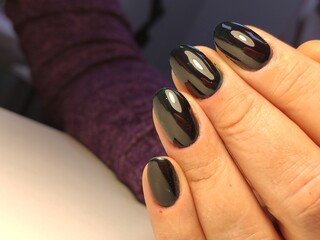 Wall Mural - beautiful manicure of nails on the background of a fashionable