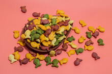 Colorful Rainbow Goldfish Crackers On A Pink Background