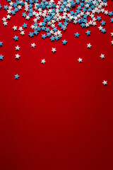 red christmas background with white and blue stars