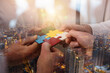© alphaspirit - Teamwork of partners. Concept of integration and startup with puzzle pieces