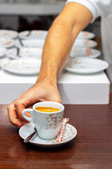 Sticker - PLASENCIA, SPAIN - Oct 23, 2020: Plasencia, Caceres, Spain. October 23, 2020.Image of a waiter serving a coffeeaurant.