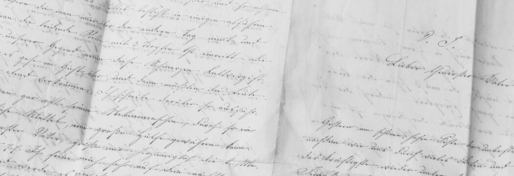 closeup of old handwriting; vintage paper background