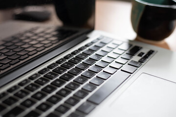 Canvas Print - Closeup shot of a laptop on the table