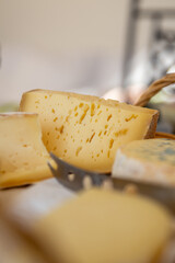 Sticker - Vertical closeup of pieces of cheese in a basket